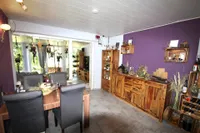 Wohnzimmer mit direktem Zugang zum Wintergarten