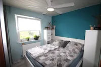 Schlafzimmer III im OG mit Blick zur Hauseingangsseite