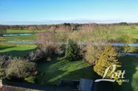 Blick über Wiesen auf die Norderbäke