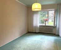 Schlafzimmer mit Zugang zum Balkon