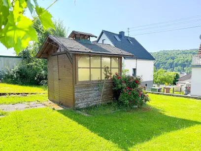 Gartenhaus mit Grillplatz