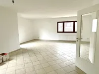 Wohn-/Essbereich mit Zugang zum Balkon