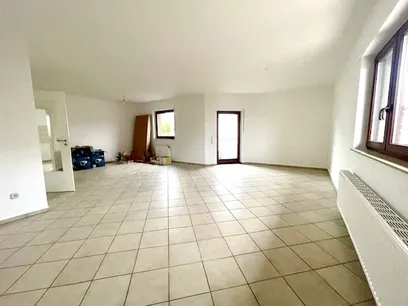 Wohn-/Essbereich mit Zugang zum Balkon