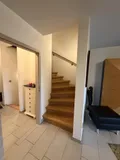 Wohnbereich mit Treppenaufgang