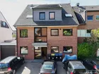 im Dreiparteienhaus