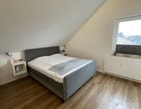 Schlafzimmer im ausgebauten Dachboden