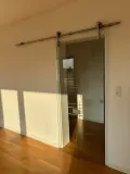 Glasschiebetürelement zum Wohnzimmer