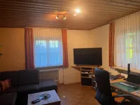 Wohnzimmer mit Kachelofen