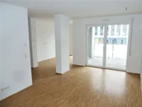 Wohnzimmer mit offener Küche