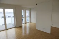 Wohnzimmer mit offener Küche