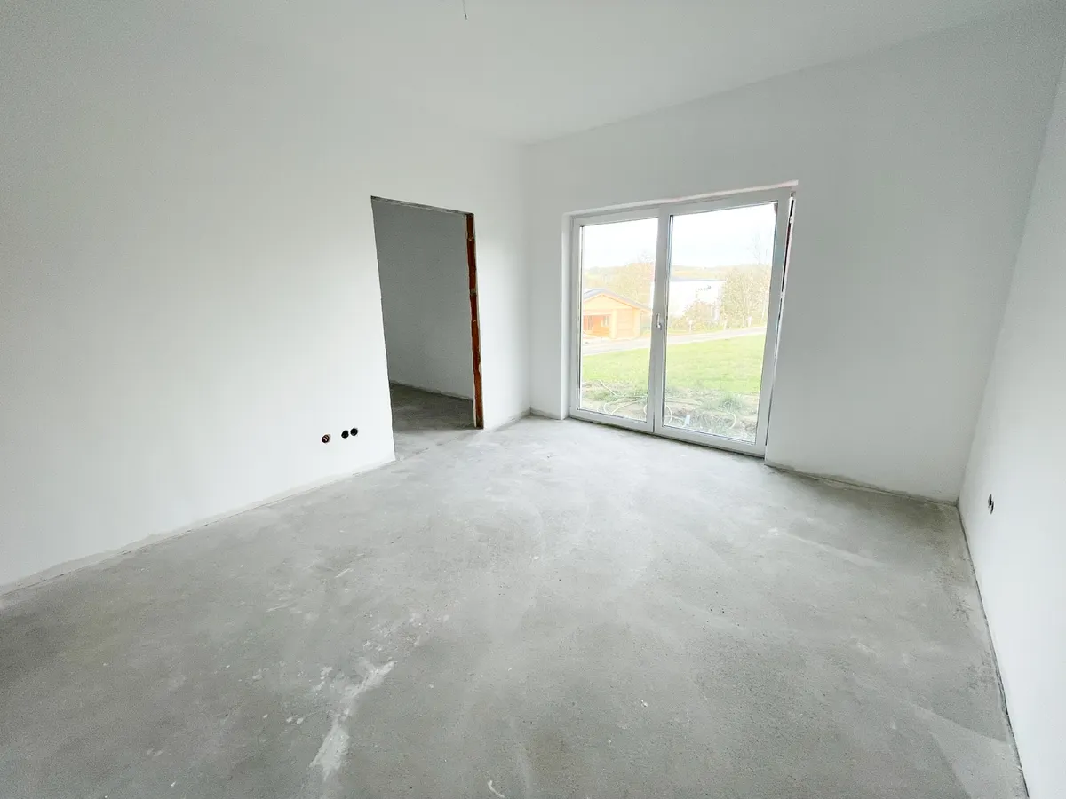 Schlafzimmer mit Ankleide im Rohbauzustand