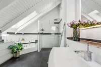 Bathroom with a tub and shower