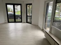 Wohnzimmer mit Balkon