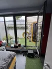 Schlafzimmer OG mit Blick auf Patio und Sauna
