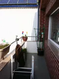 mit Austritt auf den Balkon
