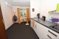 Empfangsbereich mit  Sitz- und Arbeitsmöglichk