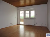 Wohnzimmer mit Zugang zur Terrasse